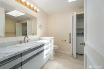 Full bathroom/laundry room. A skylight makes this room naturally shine.