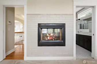 Two sided fireplace so you can enjoy in the bedroom and bathroom.