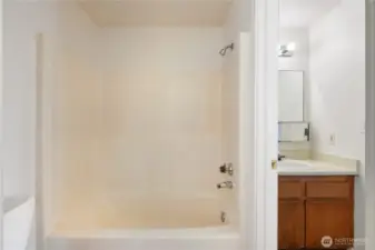 to the right of tub this phot shows the 2nd vanity located in primary bedroom