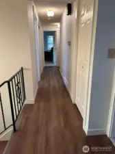 Upper level hallway with new floor and closet doors