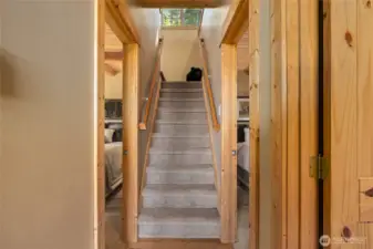 Stairs lead to upper bonus room/loft area.