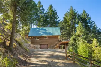Upper portion of the driveway and access to the garage/basement area.