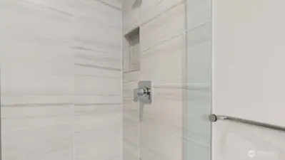 Nicely appointed shower in primary!