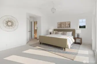 The spacious primary bedroom has been refreshed with new carpet and paint.