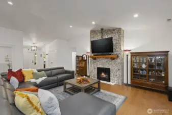 Expansive living room with beautiful stone fireplace.