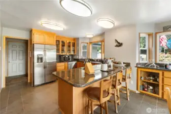 Another view of the kitchen.  Kitchen has large well lighted pantry area for storage of food supplies and various kitchen utensils.