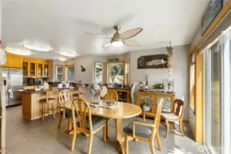 Large dining area adjacent to the kitchen and large living room.  Windows have bewuitiful views of Mt. Rainier.