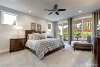 The private primary suite occupies its own wing, complete with sliders to a secluded covered patio—ideal for morning coffee.