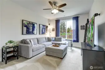 The largest bedroom includes surround sound and its own attached bath—perfect for guests or multi-generational living.