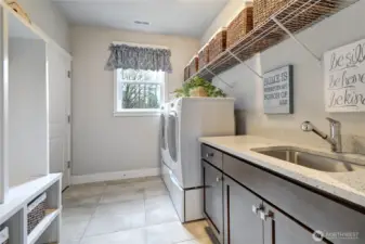 Large laundry/mudroom with tons of storage and built-ins