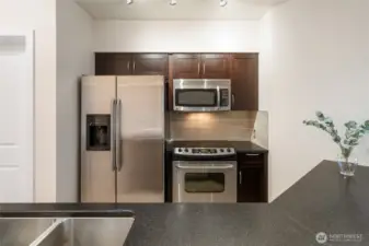 Stainless steel appliances, granite countertops, abundant storage and plenty of prep space - a dream to cook in!