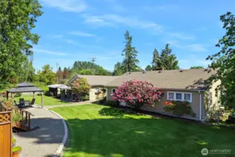 ~Relax in your Park-like Backyard with well established variety of  Roses, Rhododendrons, Lilacs, Azalea Bushes, Hydrangeas ~ Blooms start in April ~