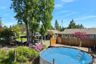 ~Relax & take a dip in the above ground pool w/custom built wooden deck & secure door to keep the kiddos safe~