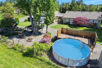 ~View of Pool & Fire Pit surrounded by flowers galore~