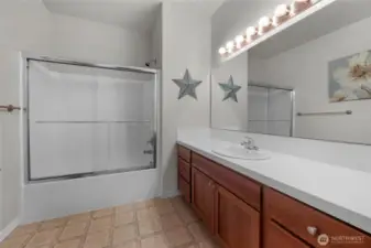 Main bathroom has plenty of counter space.