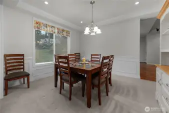 Formal dining room w/shadowboxing, the table ,chairs and side hutch stay with the home.  Could use as a second TV room if you don't use formal dining?