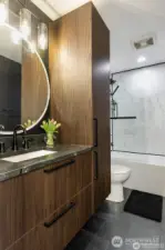 Lower floor bathroom with gorgeous cabinets and heated floors.
