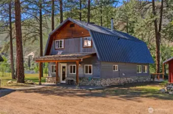 Updated home flanked by pines, Methow River, root/wine cellar, rec bld, & many outbuildings 4.3 acres.