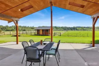 The covered back patio is a showstopper with so much room for relaxing and enjoying the view