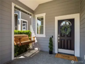 ...and inviting front porch, swing included!
