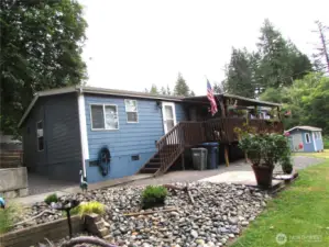 Rock Garden (Septic access lids area) adds character to peaceful setting.