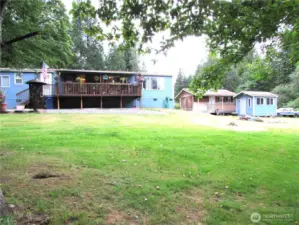 Acre plus sized lot and has separate road to access right of outbuilding area.