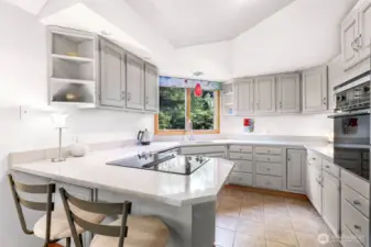 This thoughtfully laid out kitchen includes abundant cabinetry and countertop space for effortless cooking and entertaining.