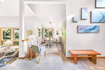 Seamless flow between dining, kitchen, and living spaces make this home ideal for gatherings, enhanced by natural light throughout.