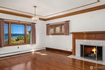 Primary bedroom with fireplace and gorgeous views of the lake.