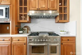 50,000 BTU Italian range is a gorgeous statement. Child-proof lock as a safety feature. Don't miss the large appliance garage!