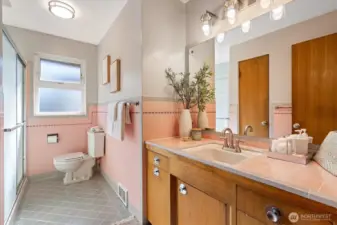 This bath on the main floor has gorgeous original tile work.