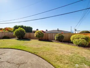 The new wood fence makes the backyard terrific and the level grassy area is well done.