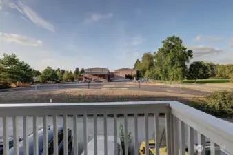 Deck off second level overlooking school playyard