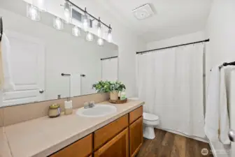 Full bathroom upstairs, generous countertop space, loads of storage space, easy care floors again