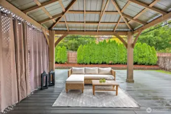 Super large gazebo on the back deck is perfect for your outdoor living, rain or shine!