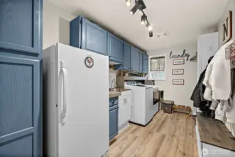 Large Utility Room with sink, room for 2nd freezer (not included) and access to fully enclosed "Catio" through the window for your furry family members.