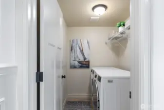 Laundry room on 2nd floor. with newer washer and dryer. Plenty of space for folding and storage.