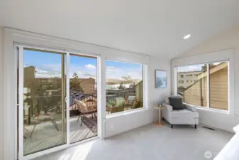 Primary bedroom on the top floor has great views of the puget sound and Mt Rainier.