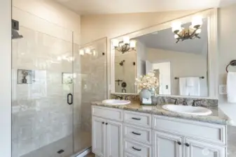 Primary bath has a newer shower and separate soaking tub, plus toilet room, two vanities, and a linen closet.