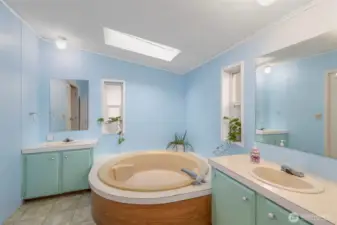 Large soaking tub in primary bathroom