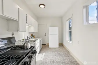 Kitchen with new appliances, gas stove