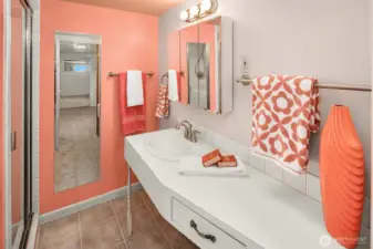 3/4 Bathroom on the Lower Level. Love those colors like it was 1955.