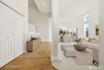 Bright and welcoming entry with soaring ceilings and beautiful natural light