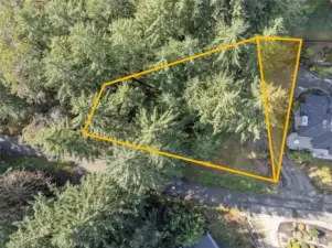 Triangular area nearest the house is the approximate portion of the vacant lot that will be removed through BLA prior to closing.   Lines are approximated, buyer to verify to own satisfaction.