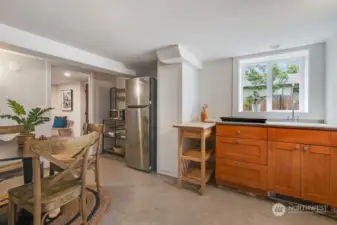 Lower level features a kitchen space that's large enough for a dining table