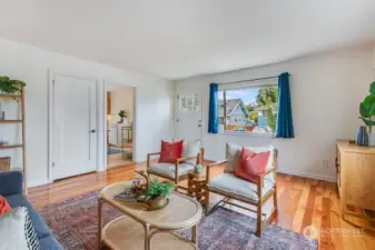 Main living room with fir floors and great natural light