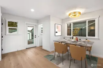 So much going on here with the dining room lit up by the woven light fixture above and the huge dining window for a cheerful outdoor view.  The backdoor and back window allows you to peek out to see what is going on in the backyard and driveway.  And the pocket door 1/2 bath is conveniently located just inside the backdoor.