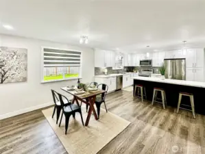 Ample dining area.  Luxury remote control blinds throughout home.