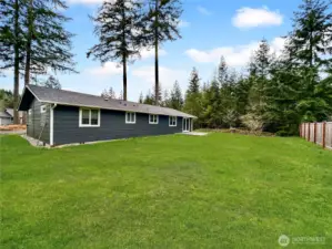 Rear view of home, sitting on just over a third of an acre.