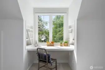 Spacious upstairs bonus/recreation room with skylight and built ins. Located above the garage.